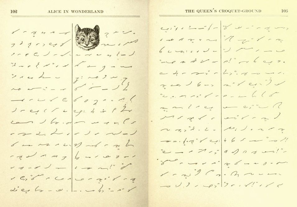 Open book with handwritten text and a small illustration of a cat's head.