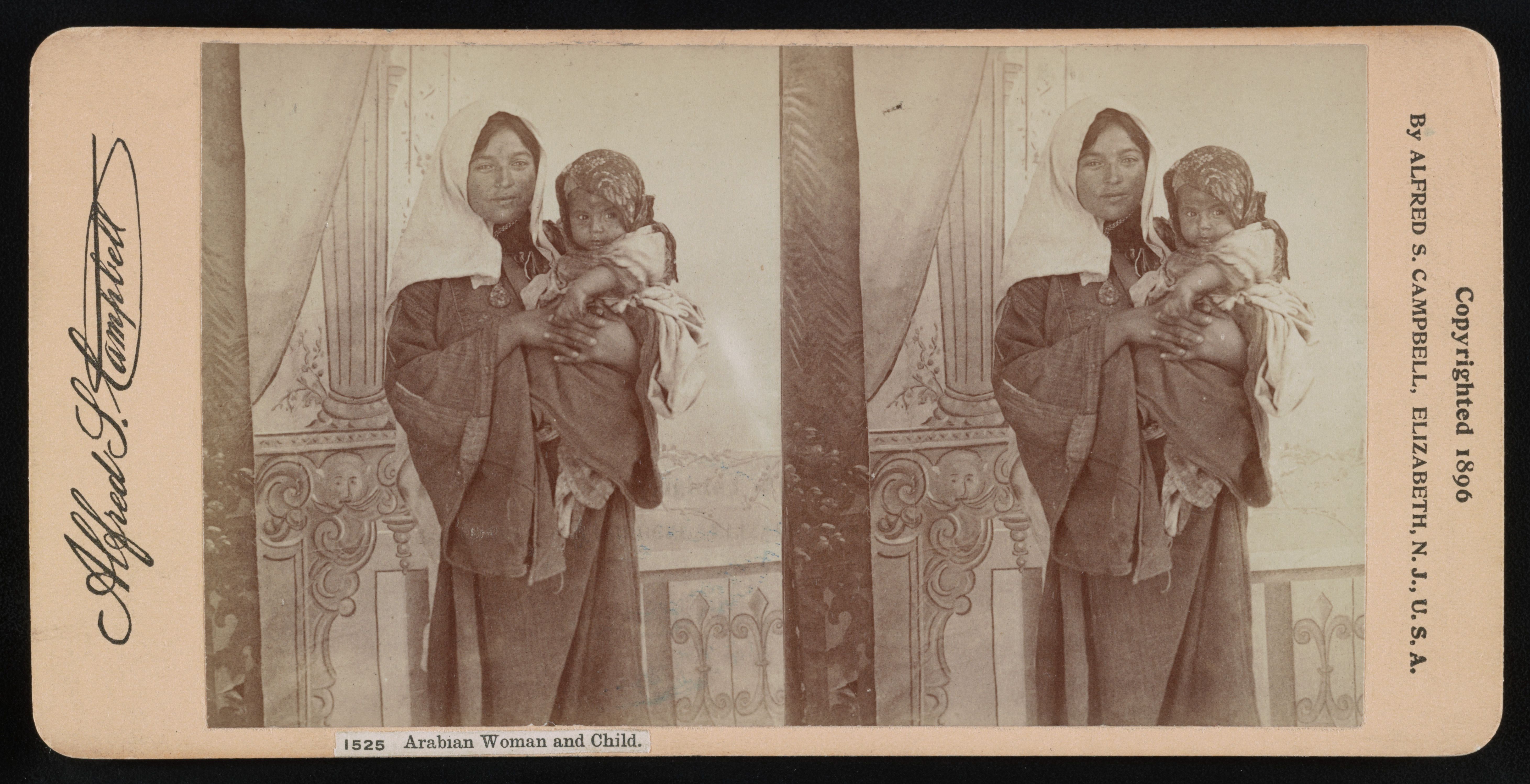 Stereoscopic photograph of an Arabian woman holding a child, 1896.