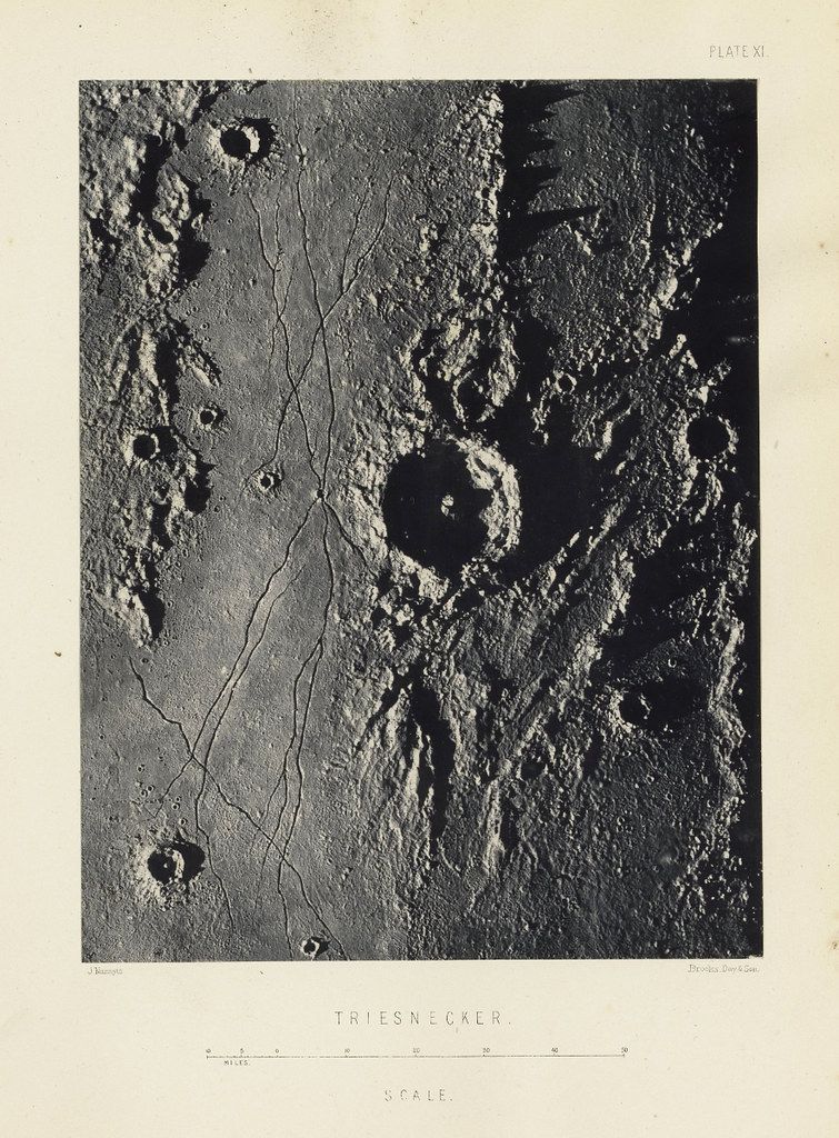 A vintage black and white photograph of a lunar surface, specifically a region named 'Triesnecker', with numerous craters and a scale indicating distances in miles.