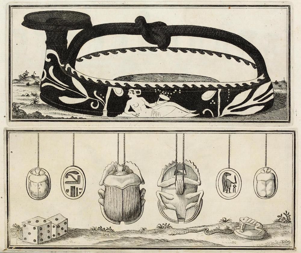 A black and white engraving depicting a collection of Egyptian artifacts and symbols, including a vessel with a reclining figure, amulets, scarab beetles, and dice.