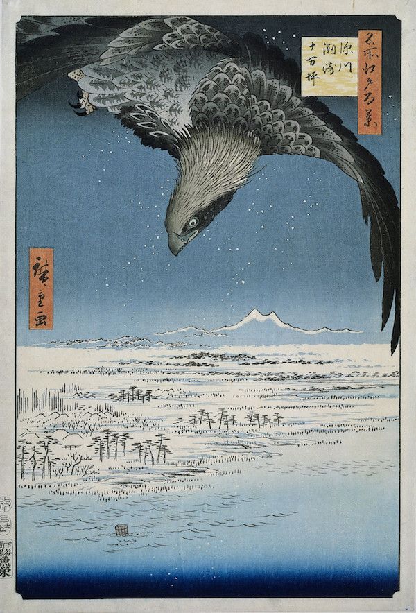 Vintage Japanese woodblock print of a hawk in flight over a seascape with mountains in the background.
