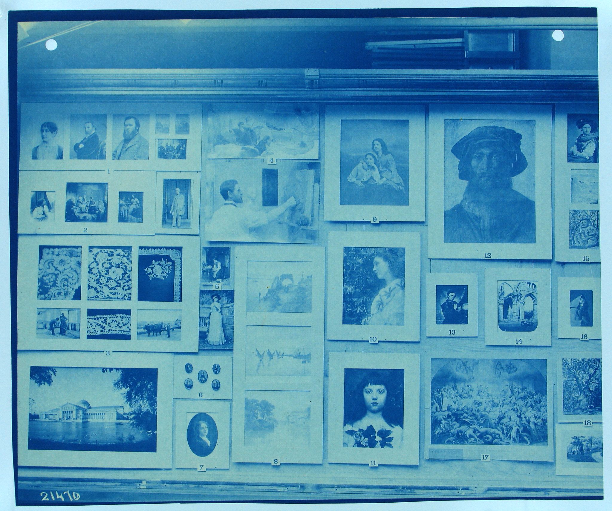 A vintage, monochromatic photograph of a wall covered in a grid of framed photographs and paintings. The images vary in subject matter, including portraits, landscapes, and floral arrangements. Each image is numbered from 1 to 18.