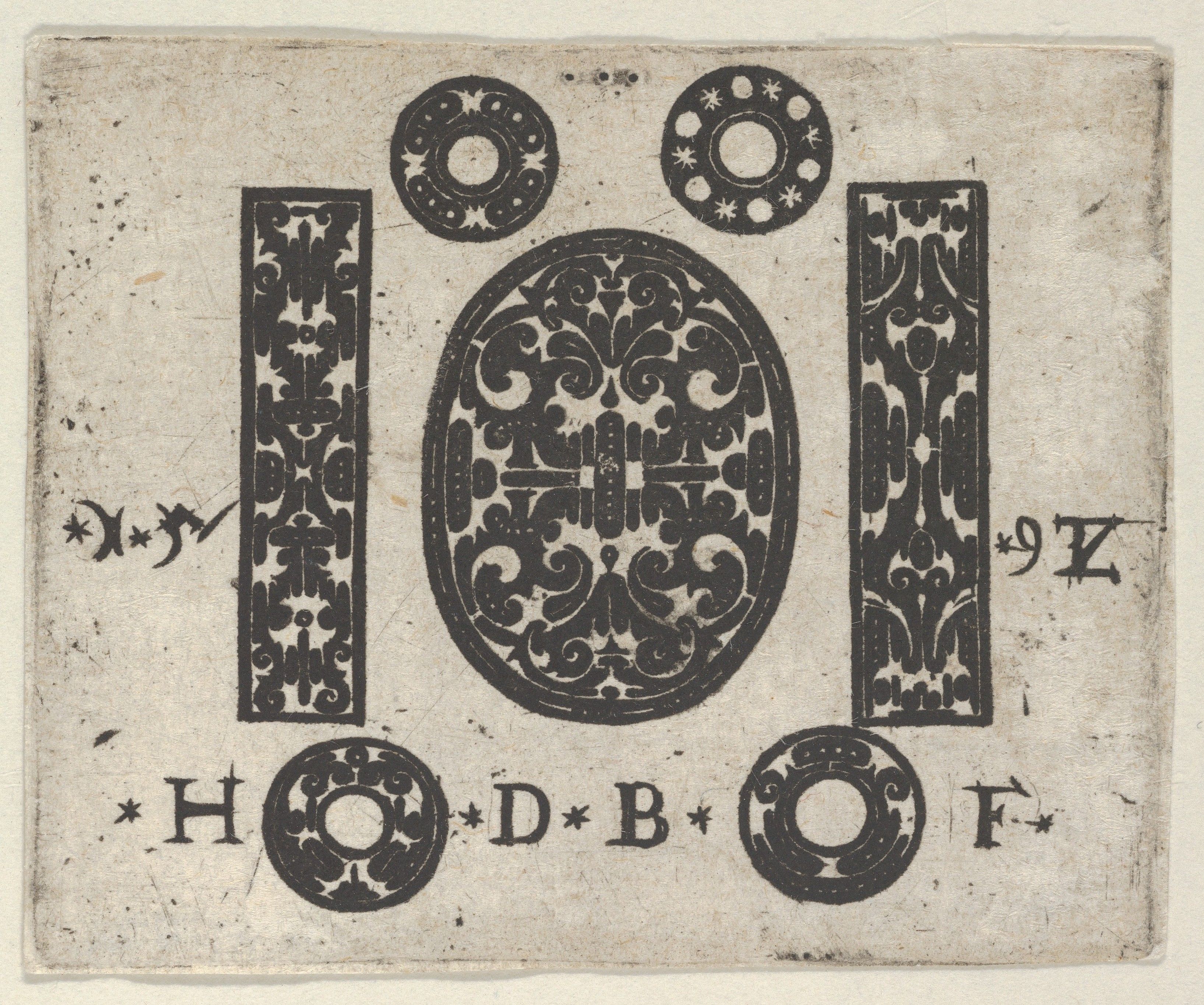 A vintage design featuring ornate floral and geometric patterns, letters, and star symbols on a cream-colored background.