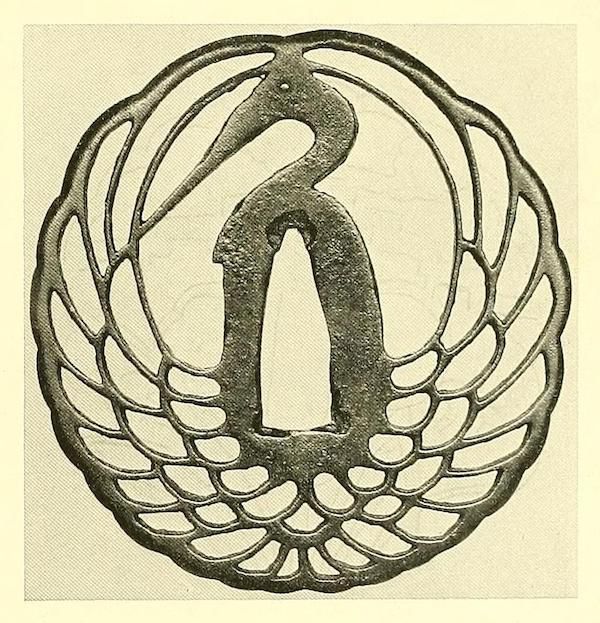 A vintage illustration of a Japanese tsuba with a crane design.
