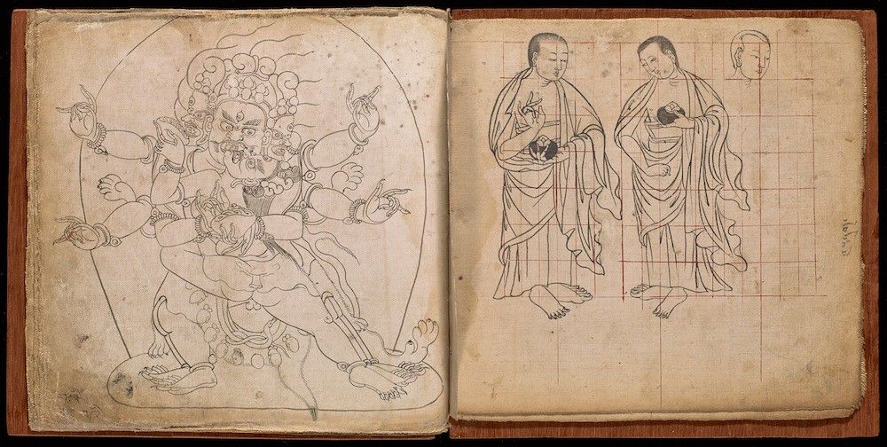 Open book with two pages filled with intricate line drawings of a deity and monks.