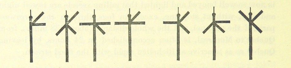 A row of seven crosses with varying designs against a pale yellow background.