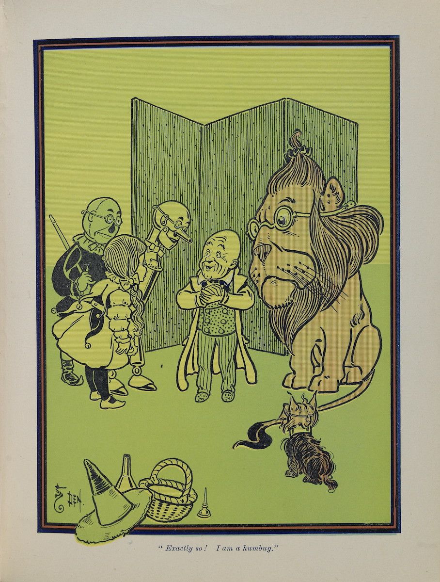 A vintage illustration of Dorothy, the Scarecrow, the Tin Woodman, and the Lion standing before a large door, with the Wizard and his guard behind it. A basket with a hat, candle, and shoes sits in the foreground. The caption reads, 'Exactly so! I am a humbug.'
