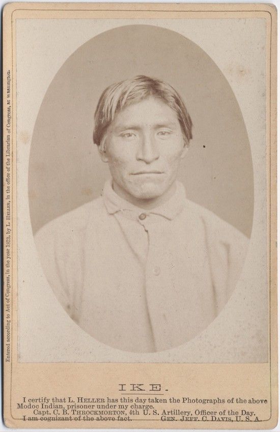 Vintage photograph of a Native American man named Ike, with text certifying his identity as a Modoc Indian prisoner.