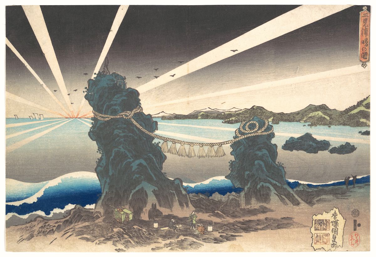 A Japanese woodblock print depicting a dramatic coastal scene with two large cliffs connected by a rope bridge, a dynamic sea with waves, mountains in the background, and a bright sun with radiating rays.