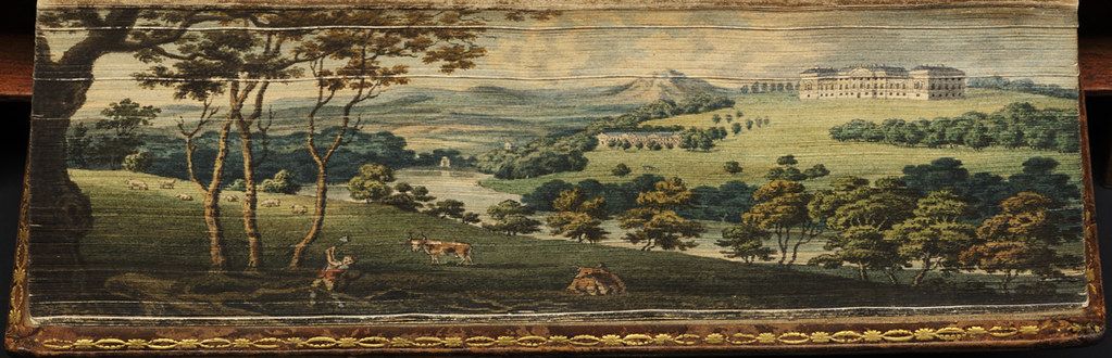 A detailed tapestry depicting a lush, rolling landscape with a grand building in the distance.