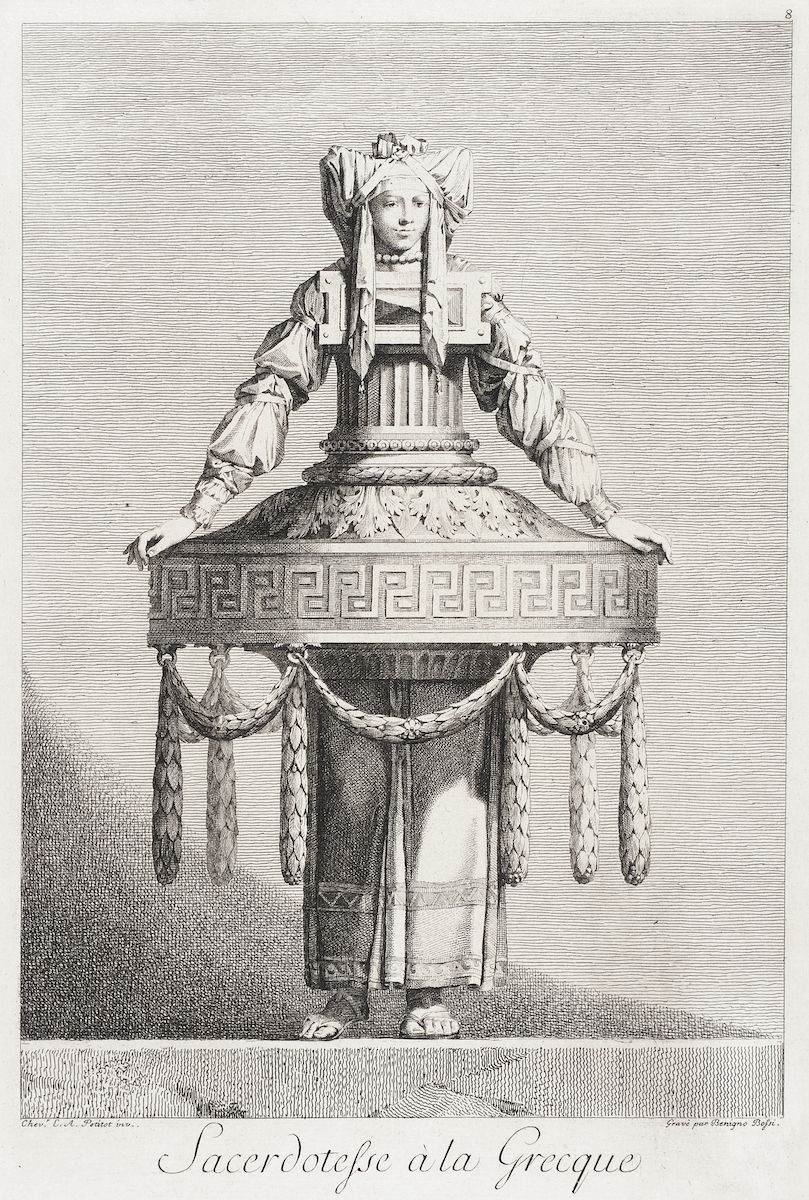 A black and white engraving of a Greek priestess standing on a raised base, surrounded by architectural elements. The priestess is wearing elaborate clothing and a tall headdress. Below the image is the inscription "Sacerdotesse a la Grecque".