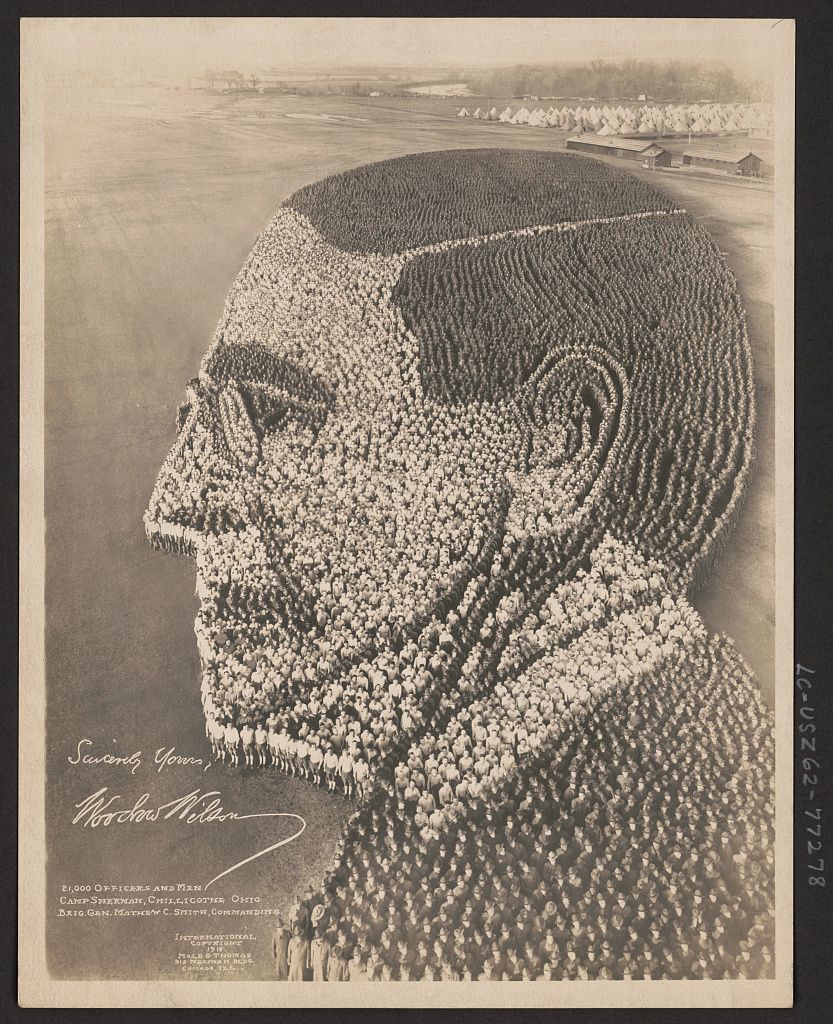 A black and white photograph of a massive group of soldiers arranged to form a portrait of Abraham Lincoln.