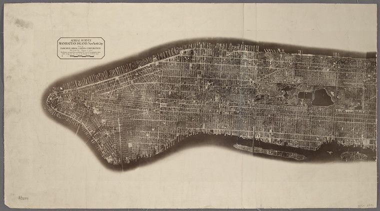 Vintage aerial photograph of Manhattan Island, New York City, showing a dense network of streets and buildings.