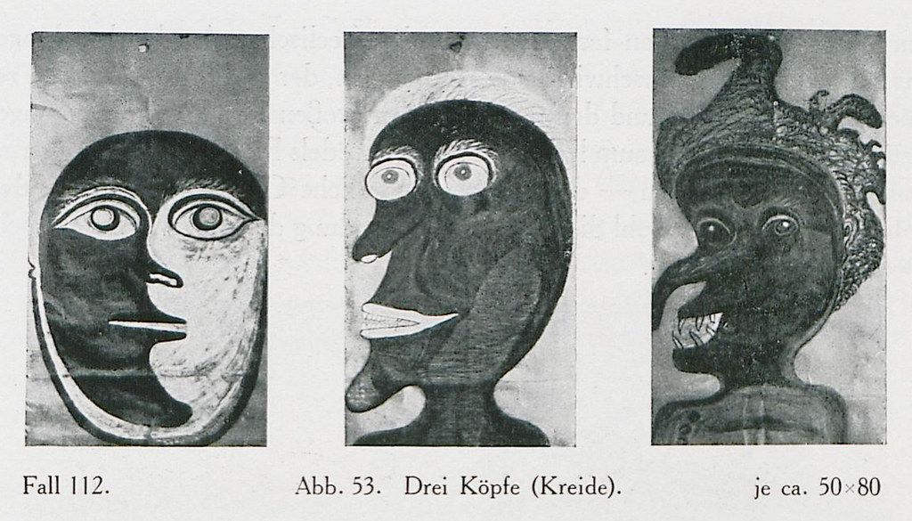 Three chalk drawings of heads, side-by-side, in a vertical arrangement. The style is reminiscent of early 20th-century expressionism or surrealism.