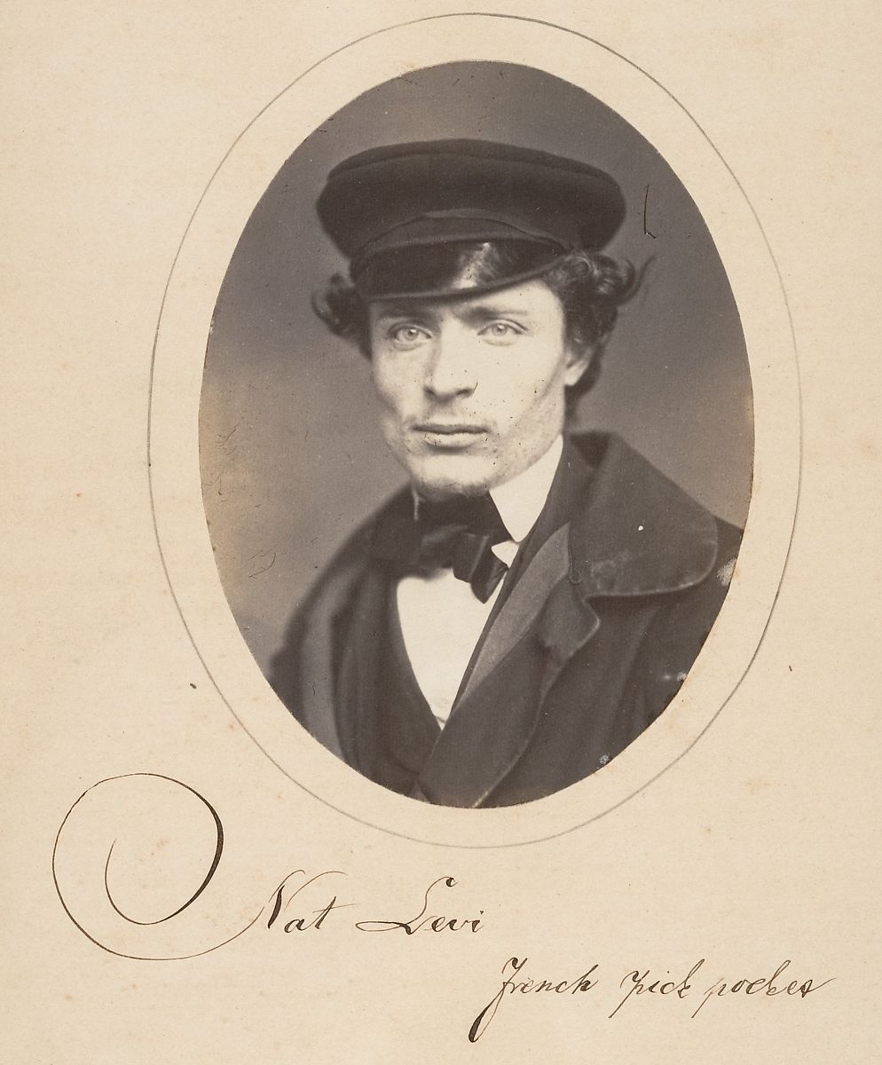 Vintage portrait of Nat Levi, a young man in a cap and suit, with a signature identifying him as a French pickpocket.