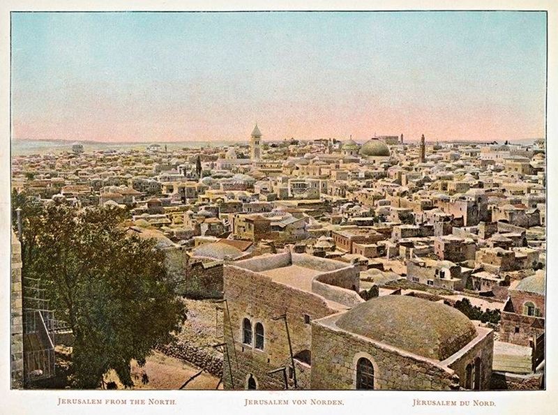 Vintage postcard of Jerusalem from the north, showing a dense cityscape with domes, towers, and surrounding landscape.