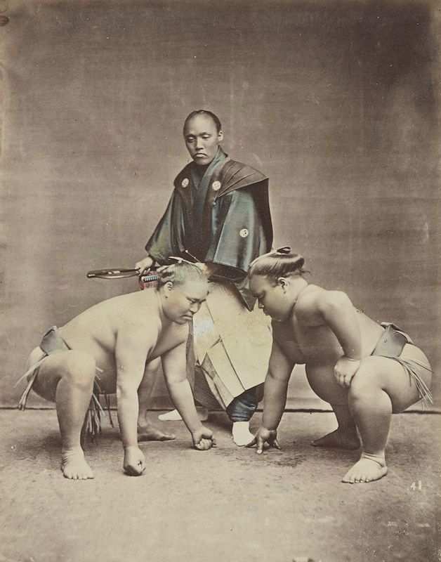 Vintage photograph of a man with three children.