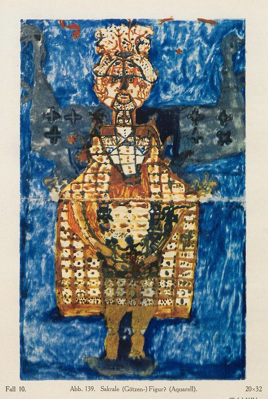 Watercolor painting of a stylized, patterned figure against a blue background, possibly a sacred idol.