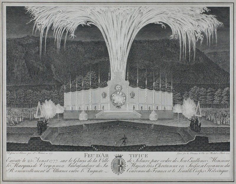 A black and white engraving of a fireworks display over a grand building facade, with mountains and trees in the background.