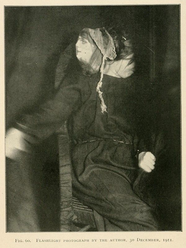 A black and white photograph from December 30, 1911, titled 'Flashlight Photograph by the Author'. The image depicts a person, likely male, heavily bandaged from head to toe.
