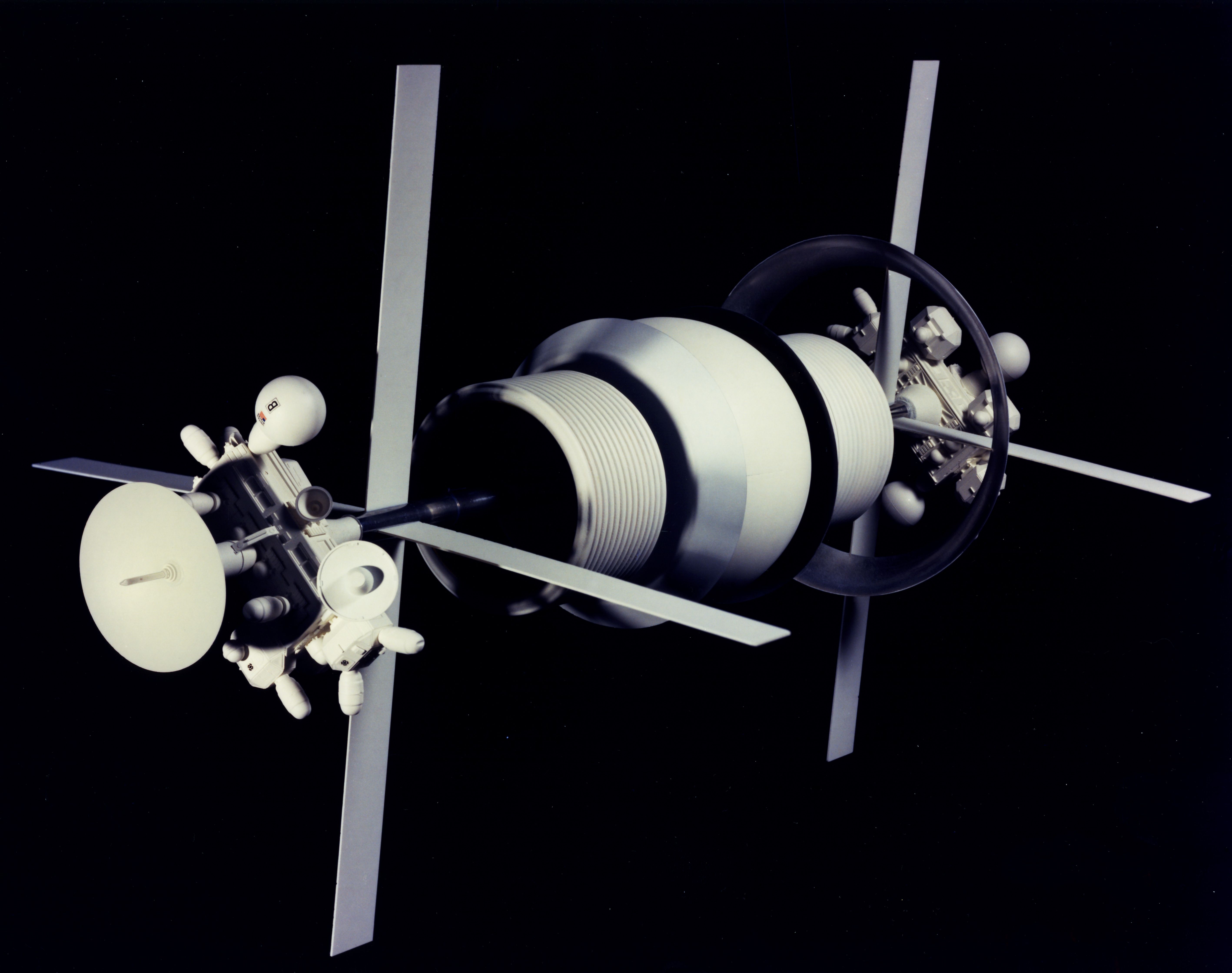 Vintage illustration of a satellite or spacecraft with a cylindrical body, antenna, and rectangular panels, set against a black background.