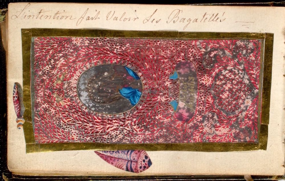 A page from a book or album with a rectangular composition filled with a dense, textured pattern of small, irregular red and white markings. Within the rectangle, there is a circular void with two small, bright blue butterflies and two stylized feathers at the bottom corners. Above the rectangle, there is handwritten text in French.