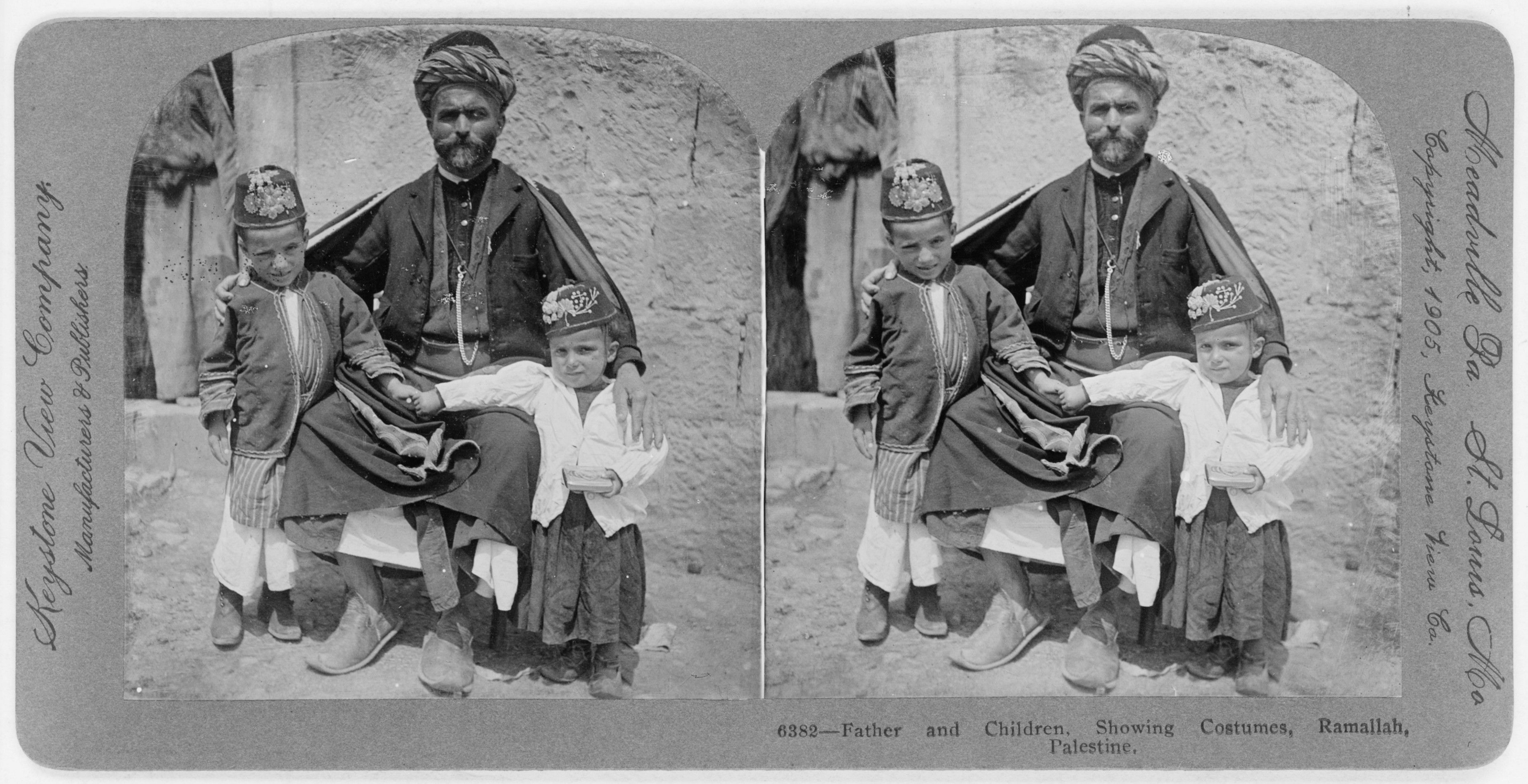 Stereoscopic photograph of a man and two boys in traditional clothing in Ramallah, Palestine, circa 1905.
