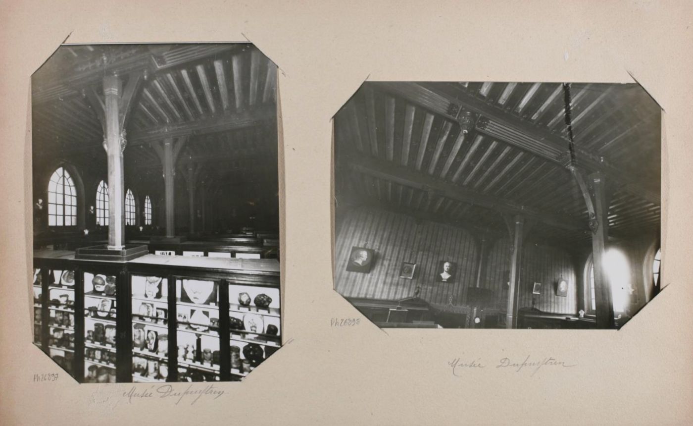 Two black and white photographs of the interior of a historic building, possibly a church or hall, with high ceilings, columns, and walls lined with portraits.