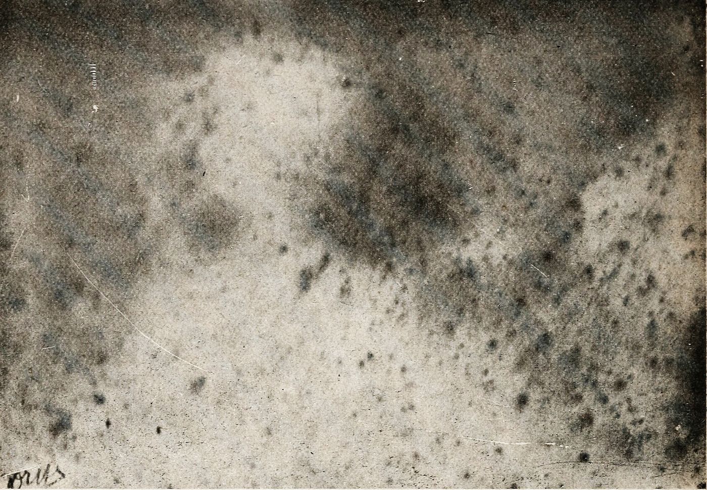 A heavily textured, aged surface with a mottled pattern of dark and light areas, scratches, and smudges.
