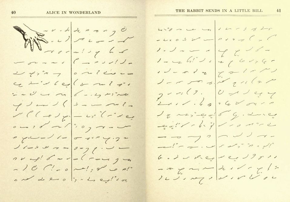 Open book with handwritten text and a hand illustration.