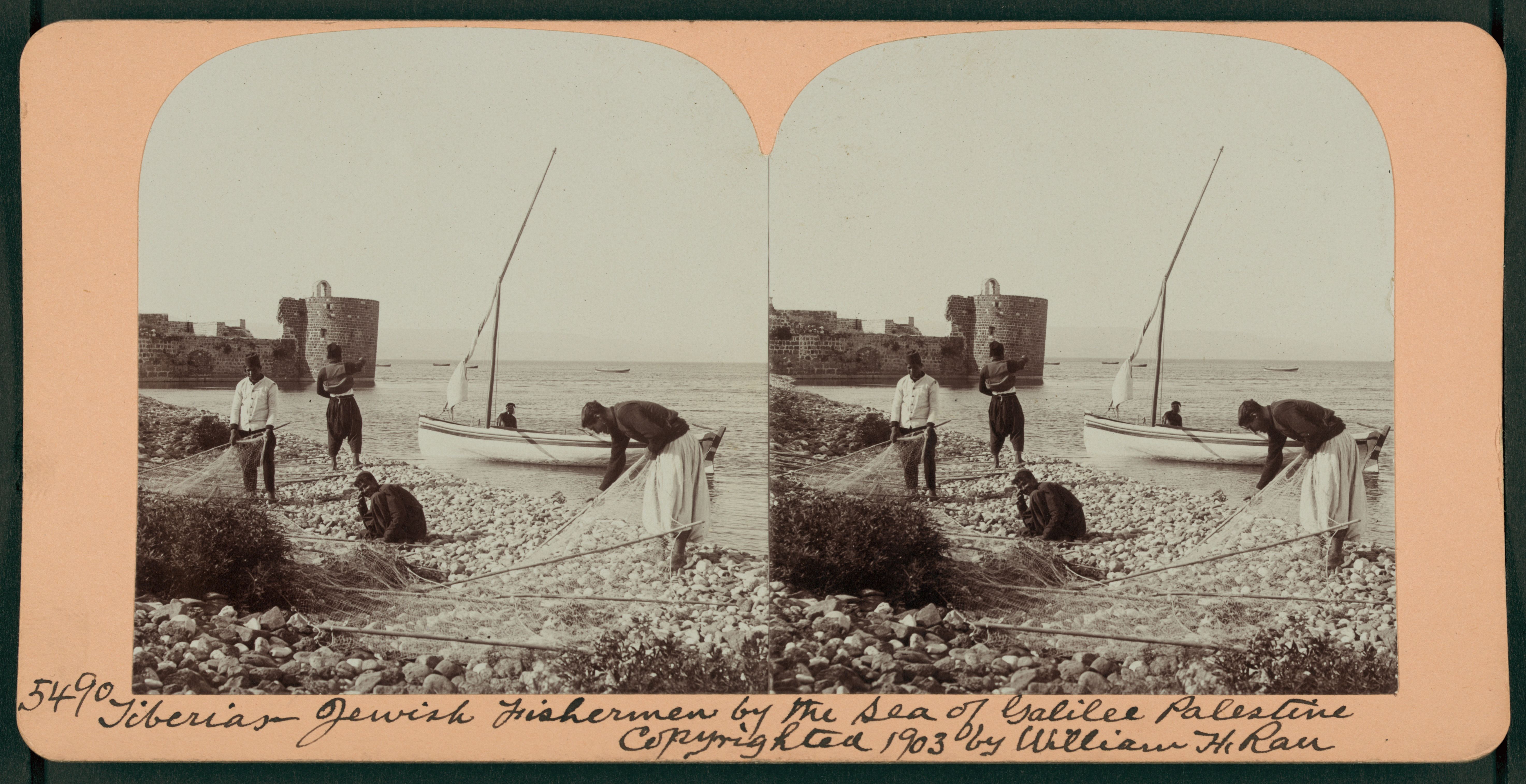 Stereoscopic photograph of Jewish fishermen working with a net on the shore of the Sea of Galilee in Palestine, 1903.