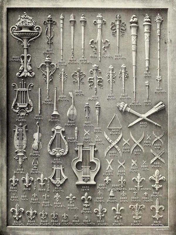 A vintage catalog page featuring a grid of detailed illustrations of ornamental designs, including floral motifs, geometric patterns, and musical instruments, each labeled with a catalog number and dimensions.