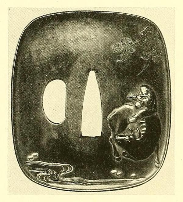 A dark, square-shaped mask with rounded corners. The mask has two large openings for the eyes, one circular and the other elongated. A detailed relief carving adorns the mask's surface, depicting a figure riding a large animal with a tree branch overhead and waves below.