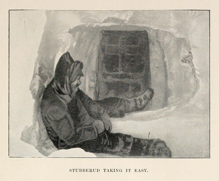 A black and white illustration of a person in a hooded garment lying down inside a cave, with the caption 'Stubberud taking it easy'.