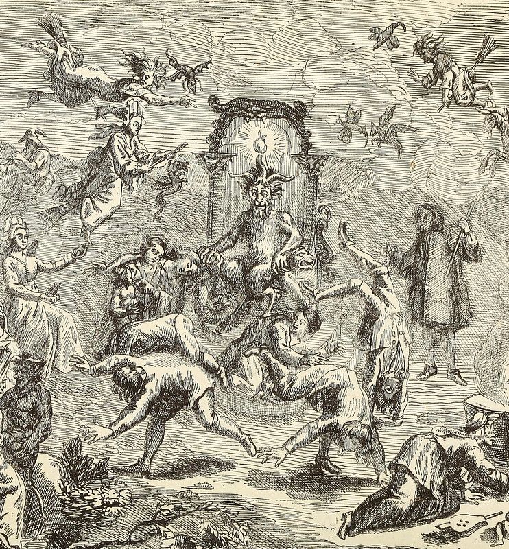 Vintage illustration of a witch gathering or sabbath, with a central devil figure and numerous dancing figures, witches flying on brooms, and a chaotic atmosphere.