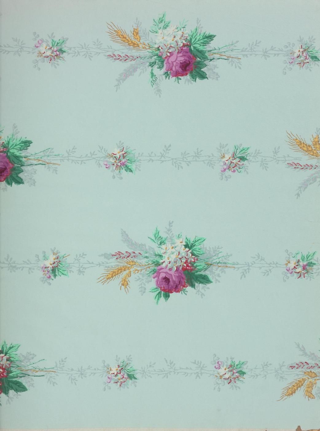 Repeating floral pattern on a light green background.