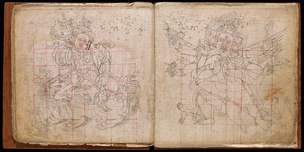 Open book with two pages featuring intricate line drawings of deities with a red grid overlay.