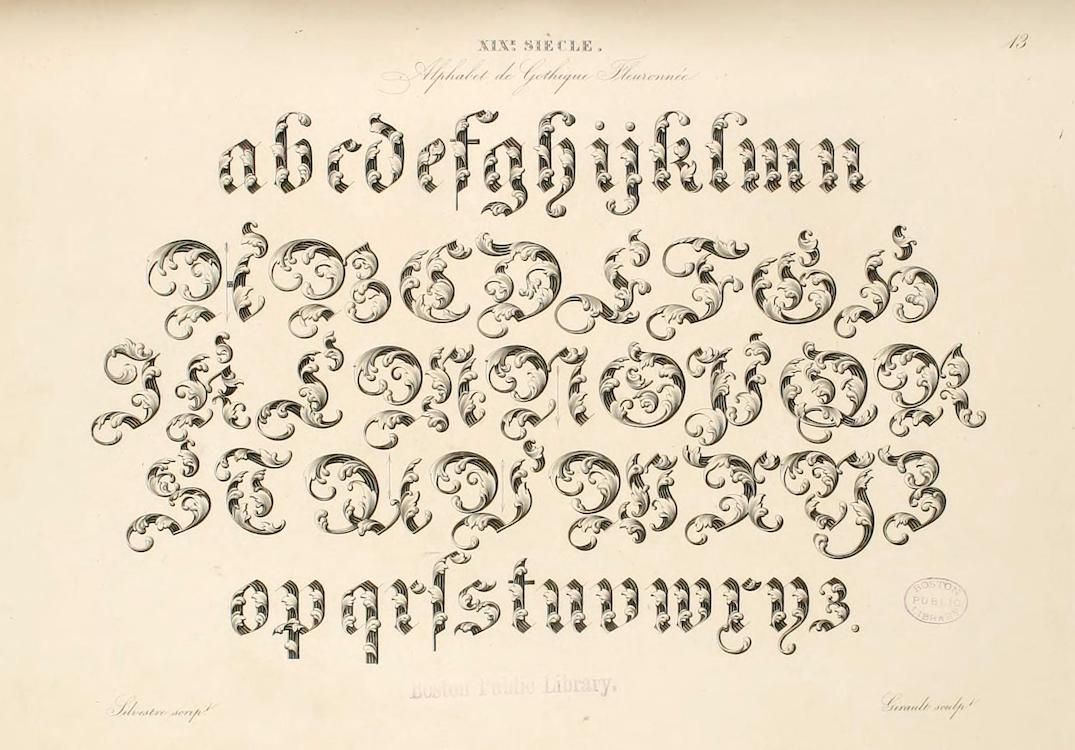 A page from a book or document featuring a highly ornate alphabet with intricate floral and scrollwork designs.