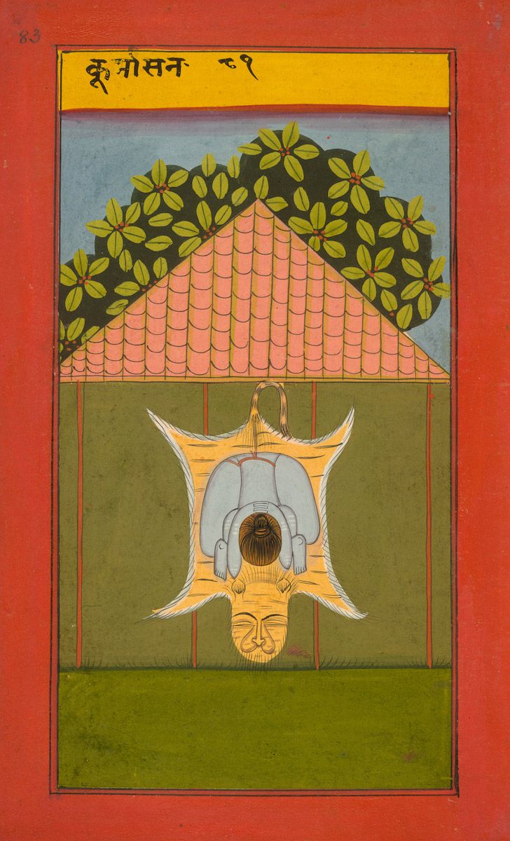 A traditional Indian painting with a central figure surrounded by symbolic elements, set against a green background and framed by a red border.