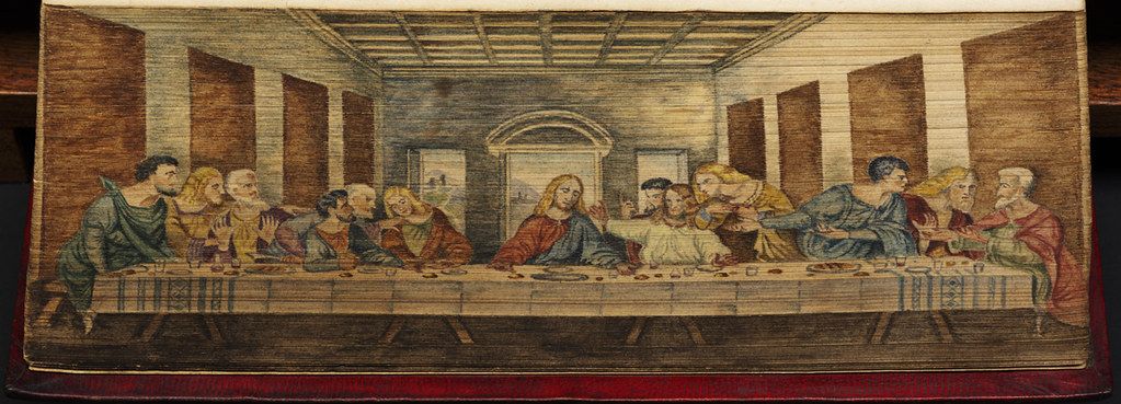 A tapestry depicting Leonardo da Vinci's "The Last Supper," showing Jesus and his twelve disciples seated at a long table in a symmetrical room.