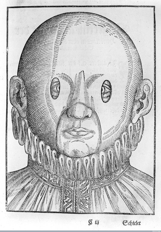 A black and white engraving of a person with a large head, wide-set eyes, and a ruffled collar.