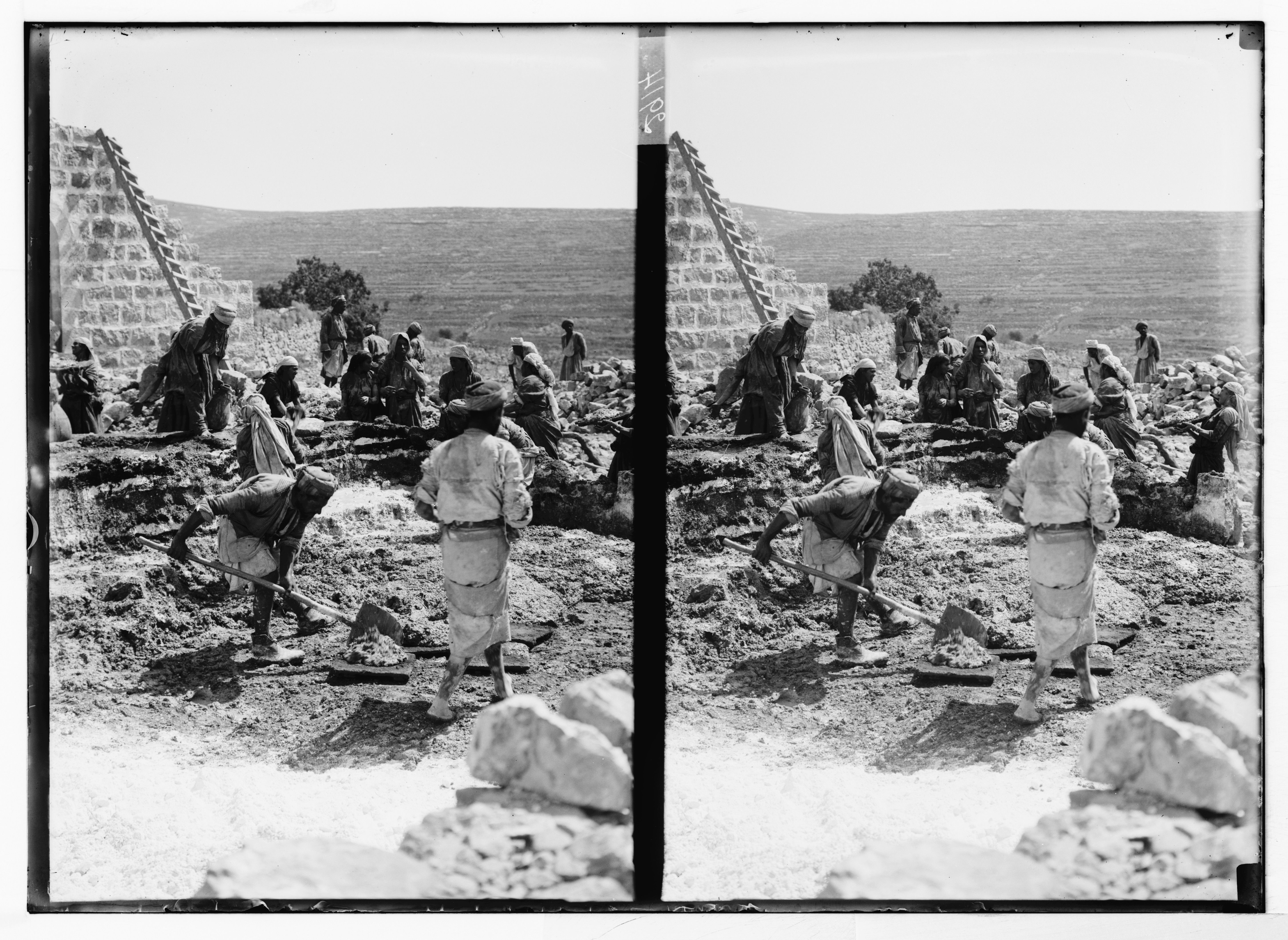 Stereoscopic photograph of an archaeological dig site with people excavating ruins in a hilly landscape.