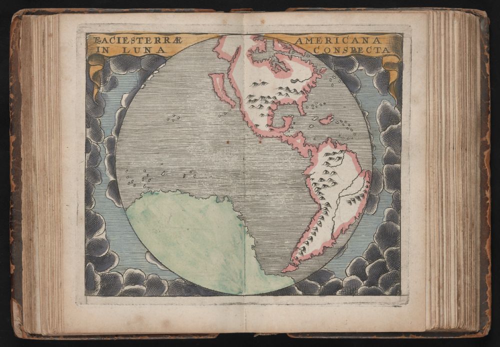 A page from an old book featuring a map of the Americas as seen from the moon.