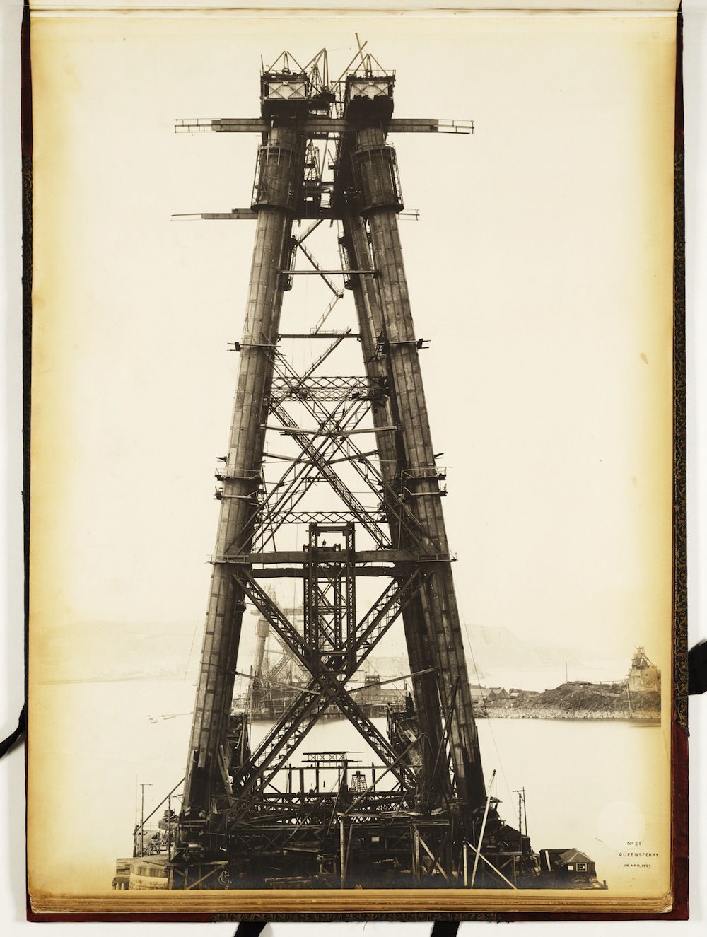 A vintage black and white photograph of a massive, intricate tower structure.