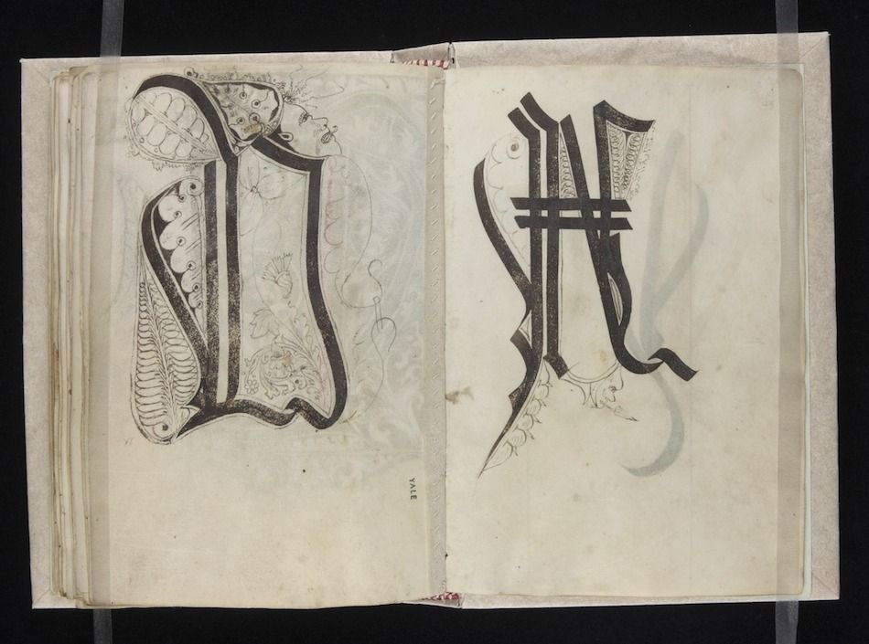 Open page from a medieval manuscript featuring ornate initial letters 'D' and 'V'.