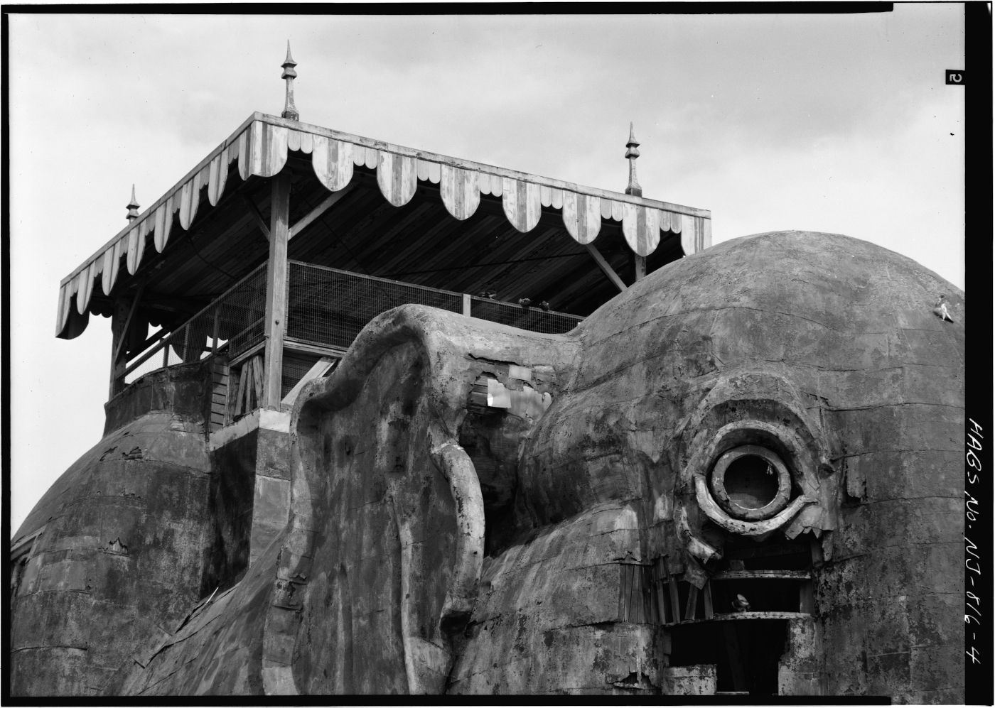 Close-up of a large, sculpted elephant head atop a building or structure.