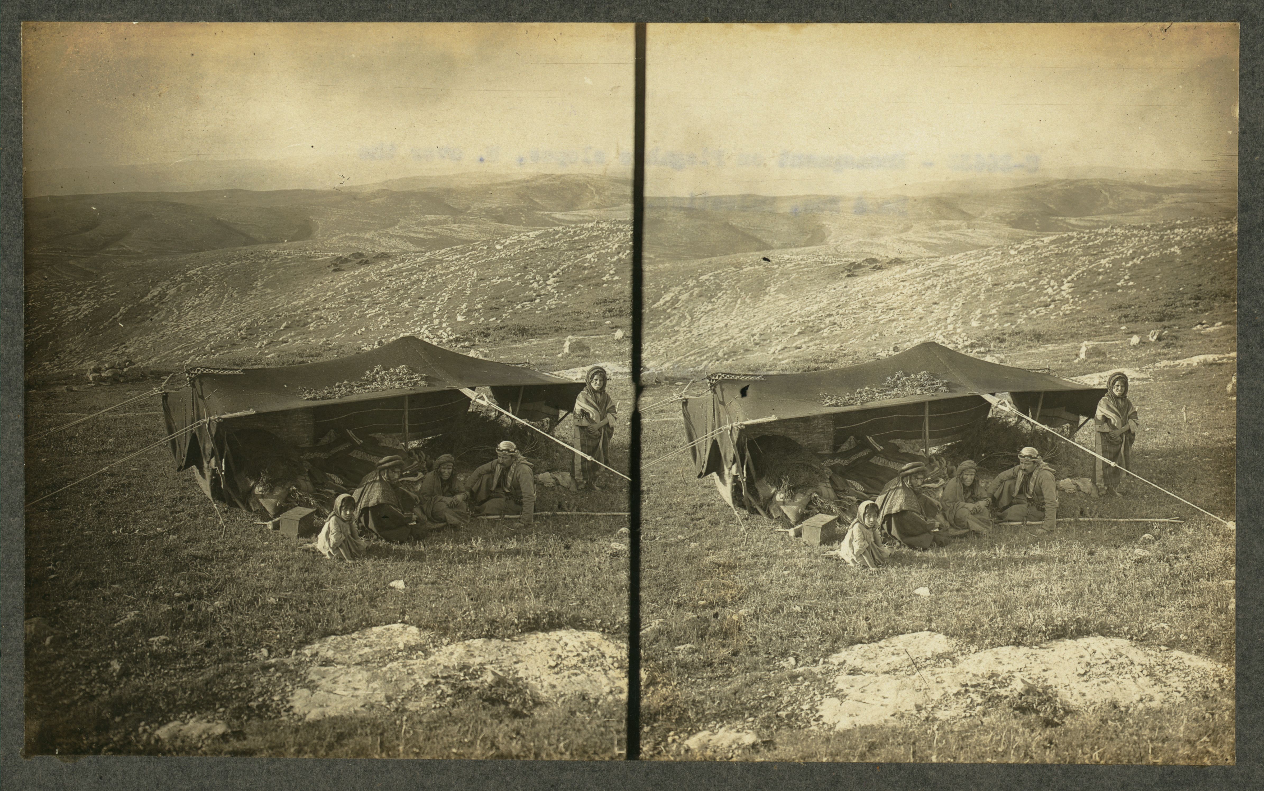 Stereoscopic photograph of a tent and people in a landscape.