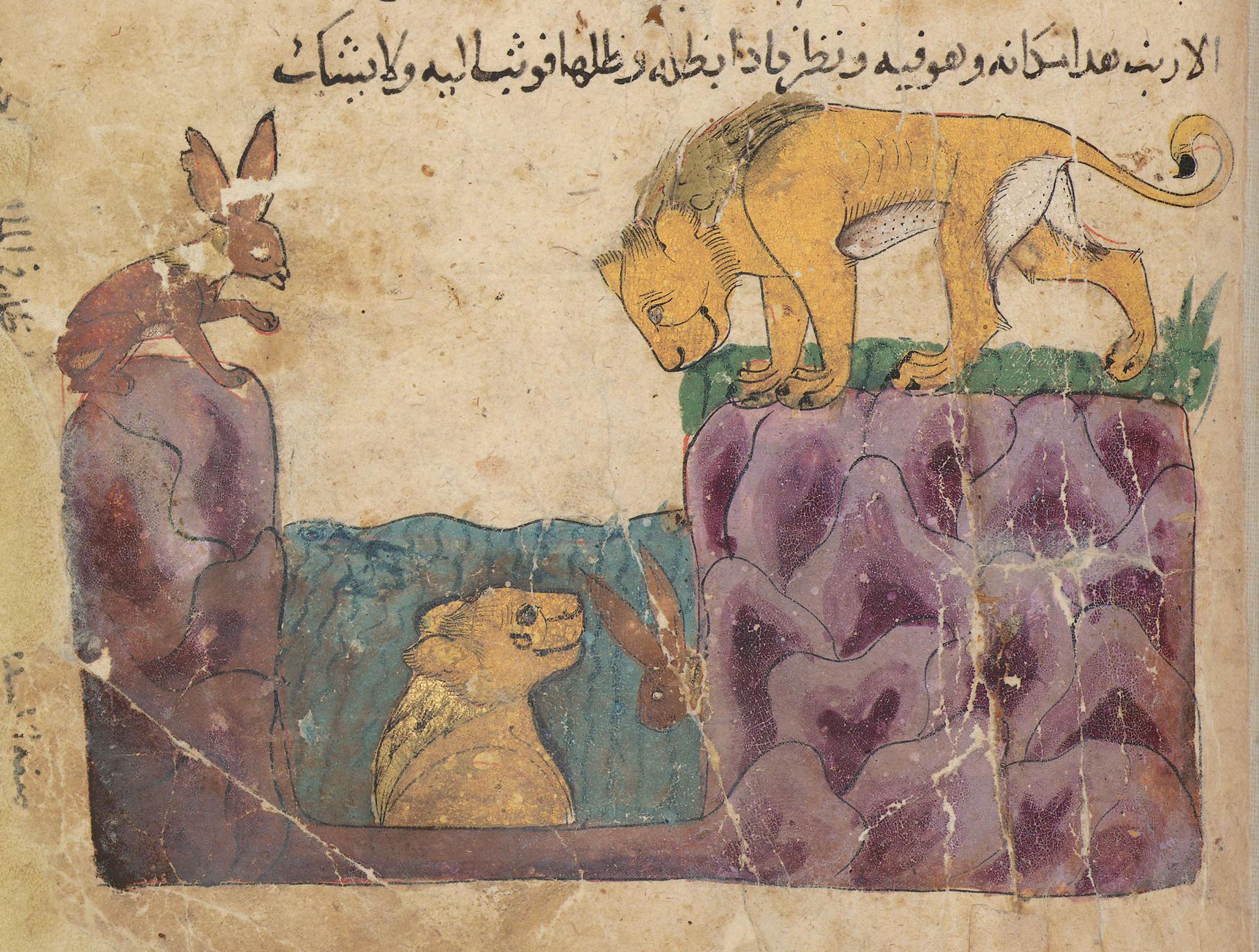 A medieval manuscript illustration depicting a lion poised to pounce on a gazelle near a rocky outcrop and body of water.