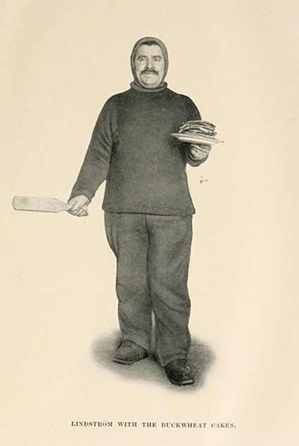 Vintage illustration of Lindstrom holding buckwheat cakes on a plate and a spatula.