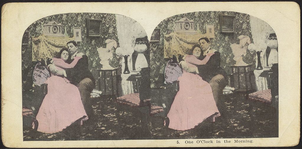 Stereoscopic card titled "5. One O'Clock in the Morning" depicting a man and a woman embracing in a lavishly decorated room.